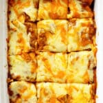 An overhead view of the casserole cut into serving sized squares