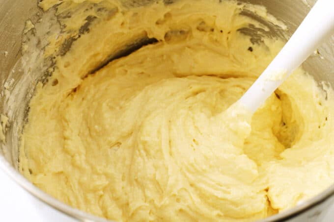 Caramel cake batter in a bowl. It is yellow and thick