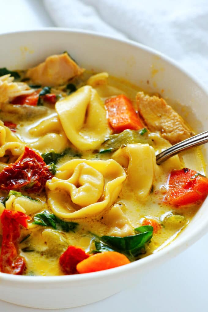 a close up of the vibrant colors of Chicken Tortellini Soup