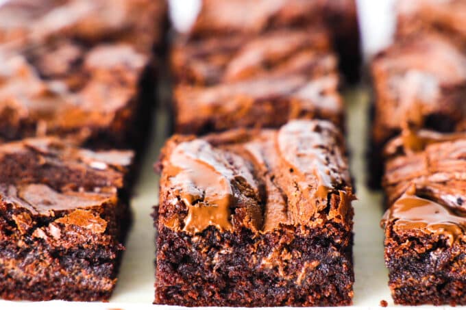 Nutella brownies in rows on a white surface