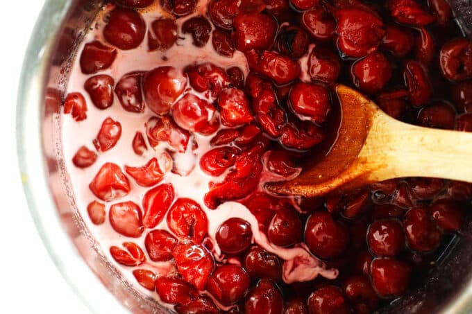 the cornstarch slurry being mixed into the cherries