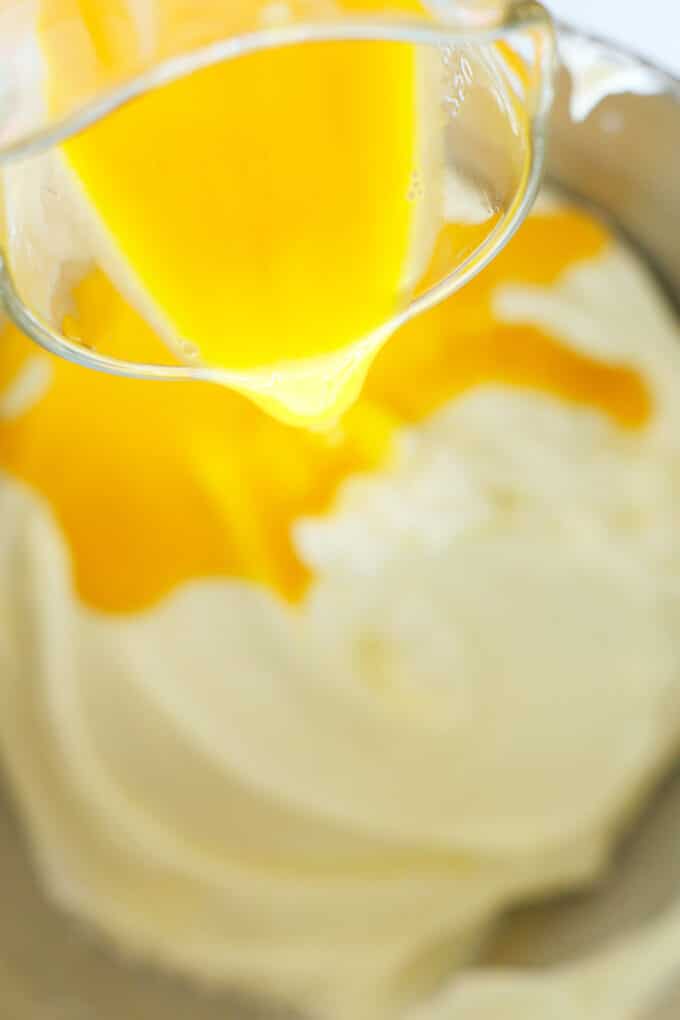 the egg mixture being added to the cream cheese mixture