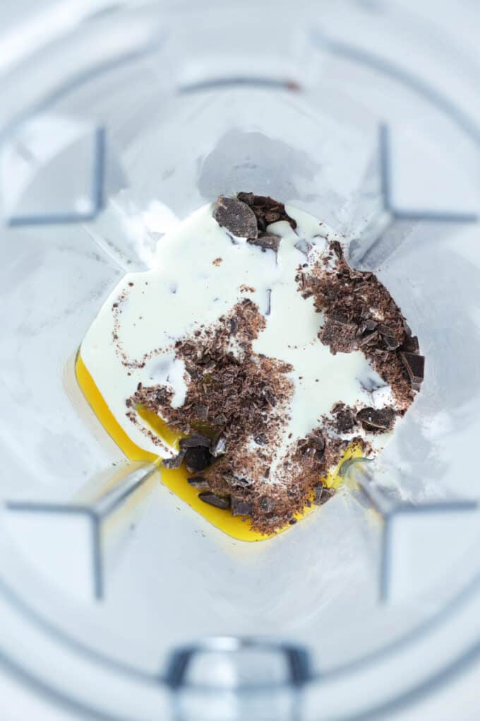 chocolate, egg yolks, and heavy cream in a blender before being mixed