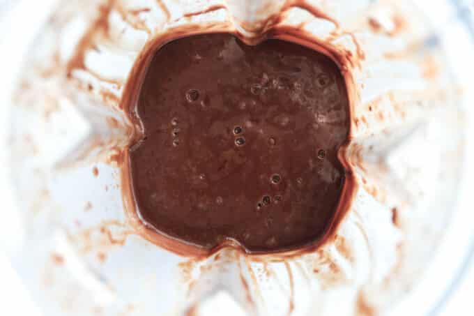 an overhead look at the melted chocolate mixture in the blender