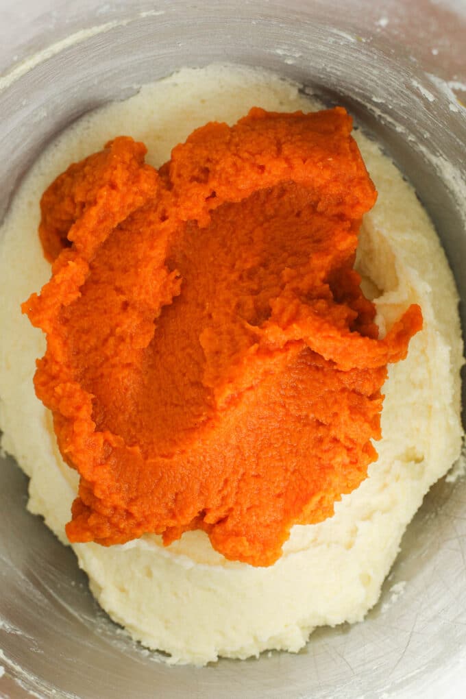bright orange Pumpkin Puree added to the creamed butter and sugar mixture but not yet mixed in