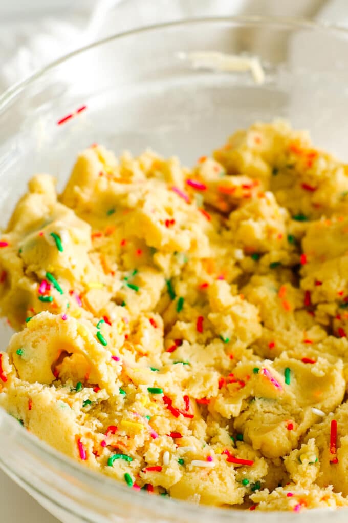 the Funfetti cookie dough in a bowl with sprinkles mixed in