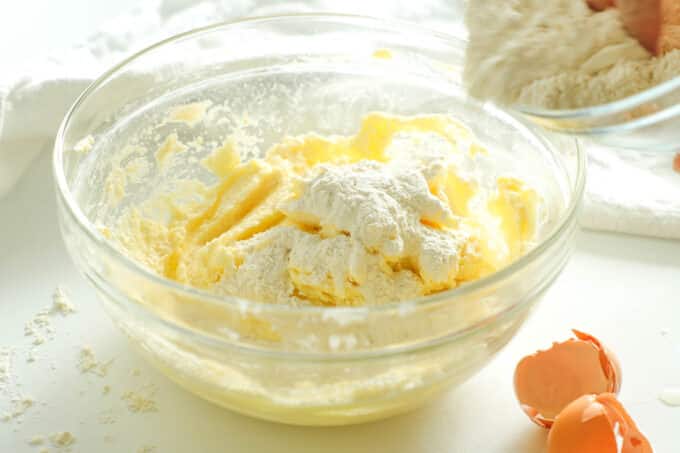 Dry ingredients being added to the butter and sugar mixture