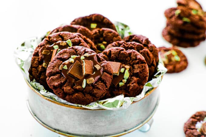 Andes Mint Cookies stacked in a round tin.