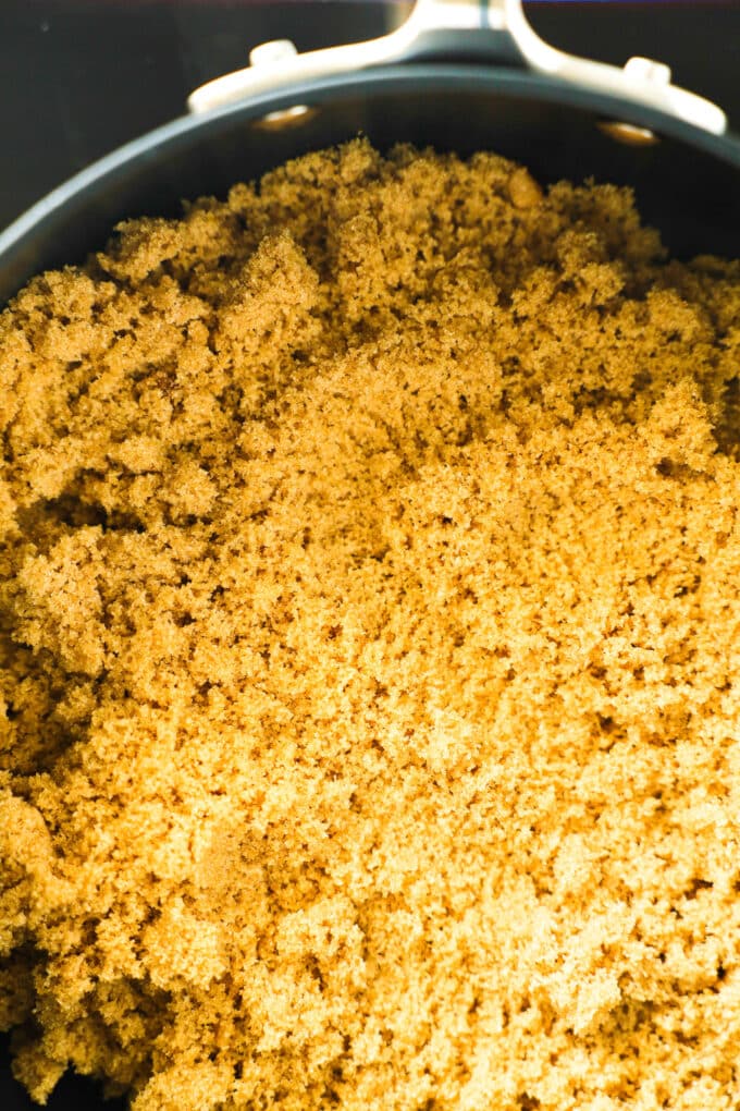 A close up of brown sugar in a pan.