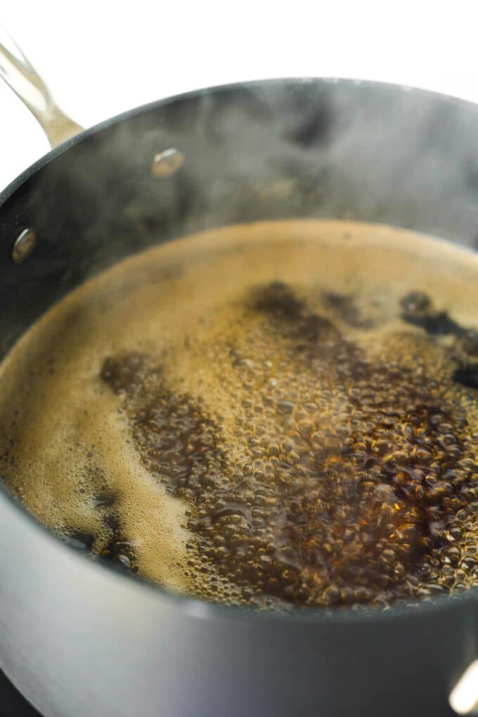 Brown sugar simple syrup boiling in a pan.