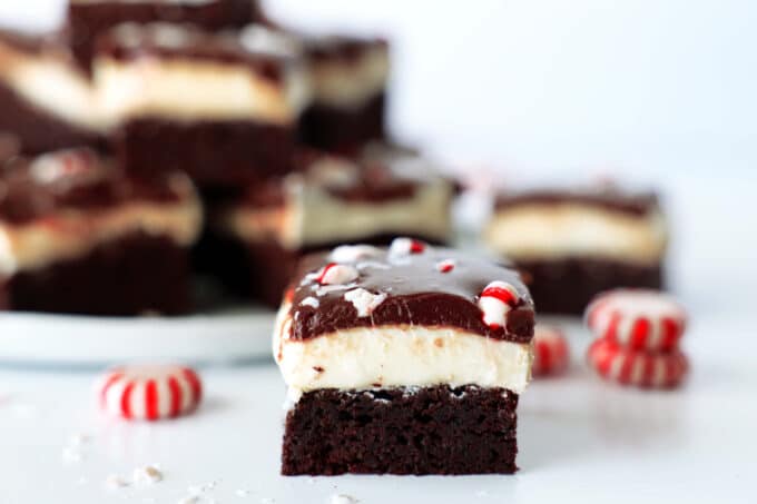 A single Peppermint Brownie sits on the counter in front of the others, peppermint candies scattered nearby.