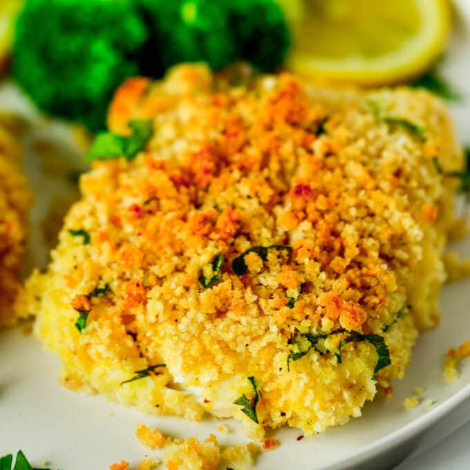 A close up of a Baked Fish fillet. It is golden brown and very crunchy looking.