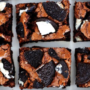 An overhead view of Oreo Brownies cut into squares, with big pieces of Oreo cookies on top.