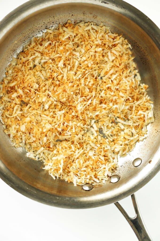 Shredded coconut once it has turned golden brown in the skillet.