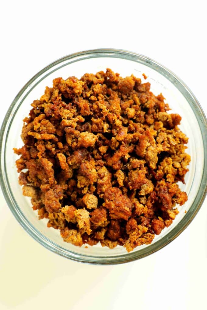 An overhead look at a bowl of cooked, ground beef.