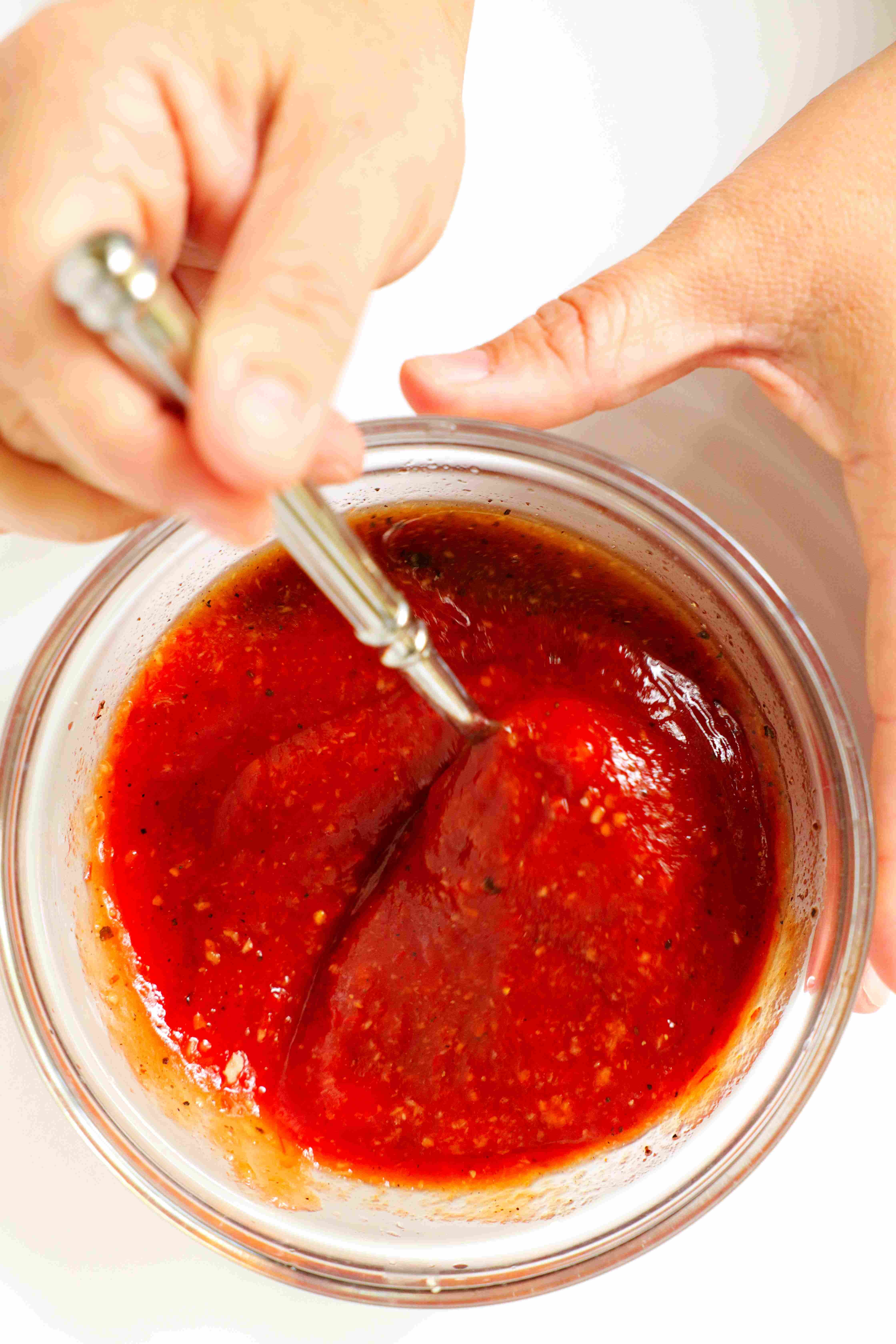 Shrimp cocktail sauce being mixed in a small bowl