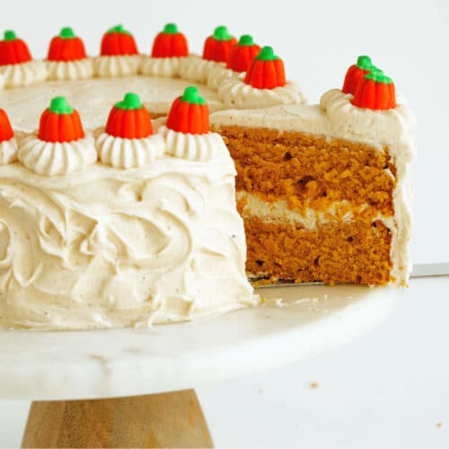 Pumpkin cake being sliced to show the multi-layered center