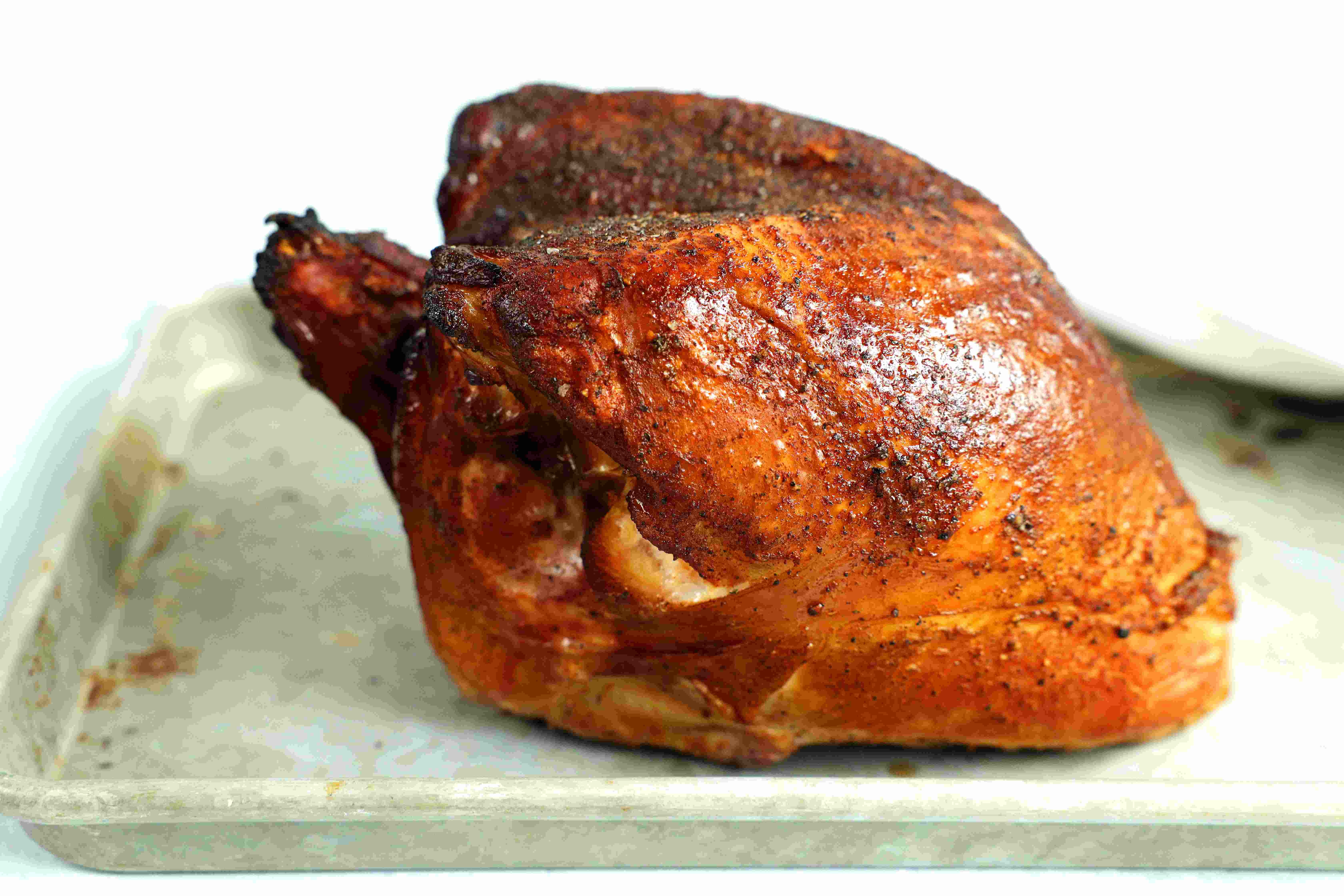 Whole Smoked Turkey Breast on a baking sheet