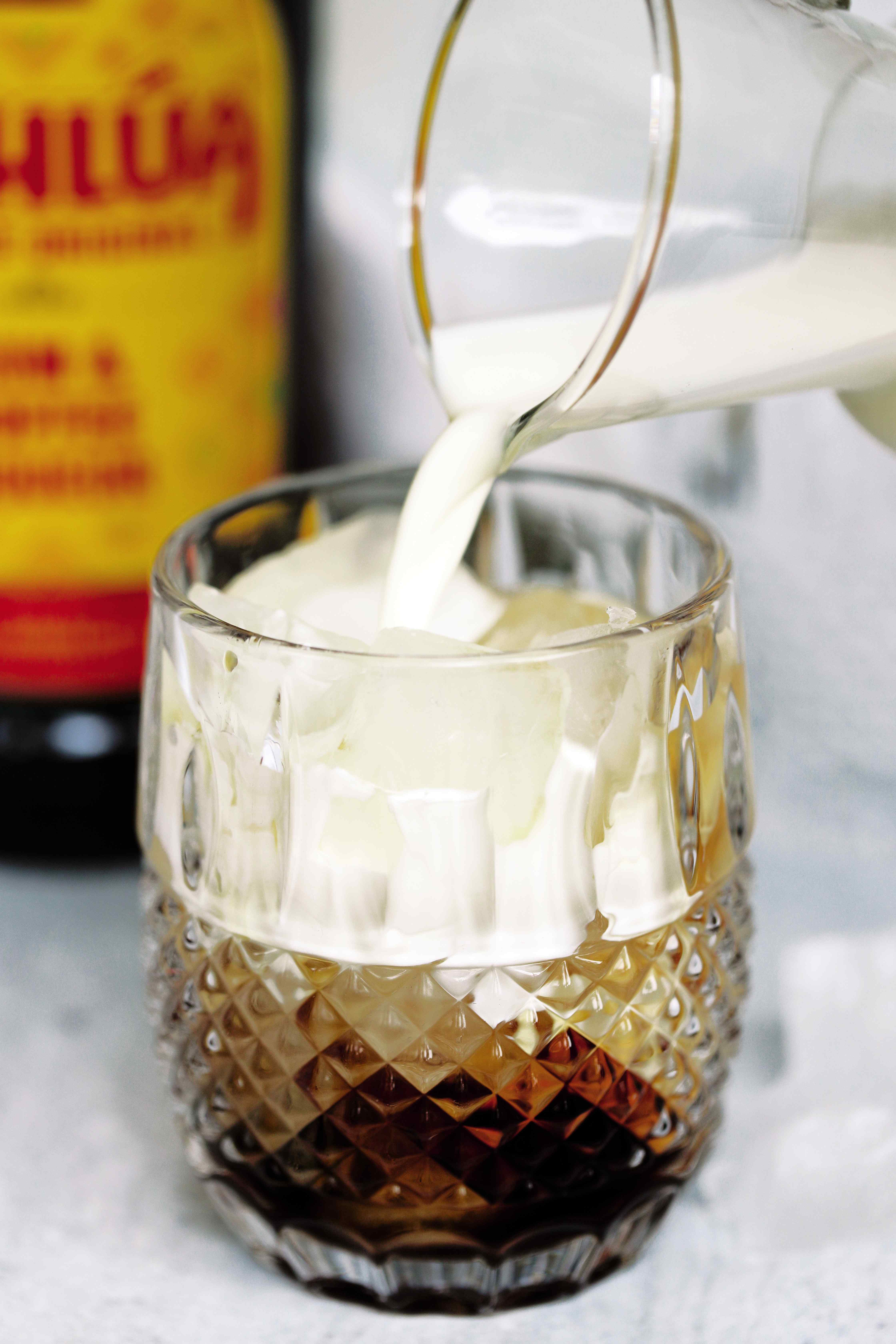 Cream being poured into a White Russian