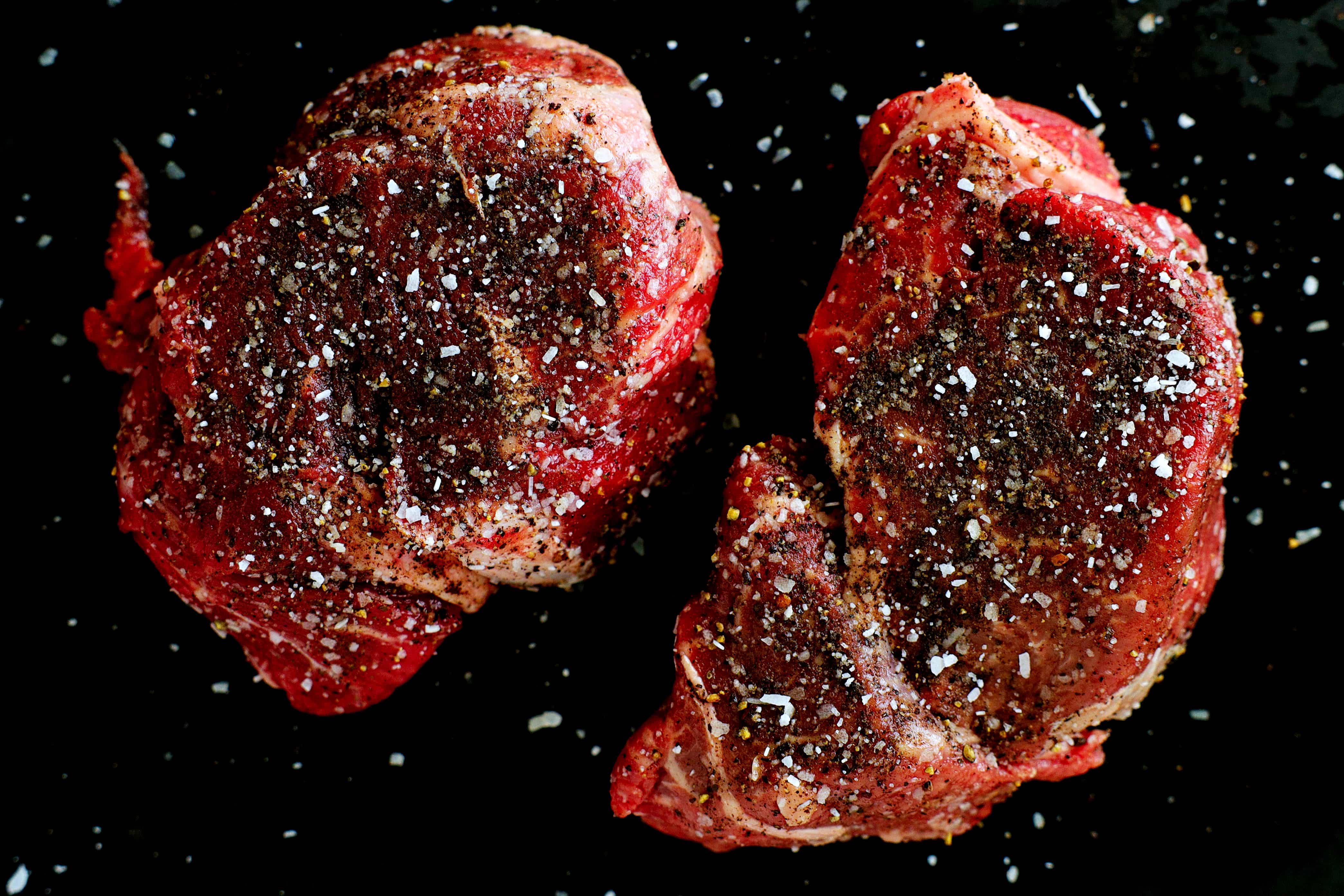 Seasoned Cast Iron Filet Mignon steaks ready to be seared