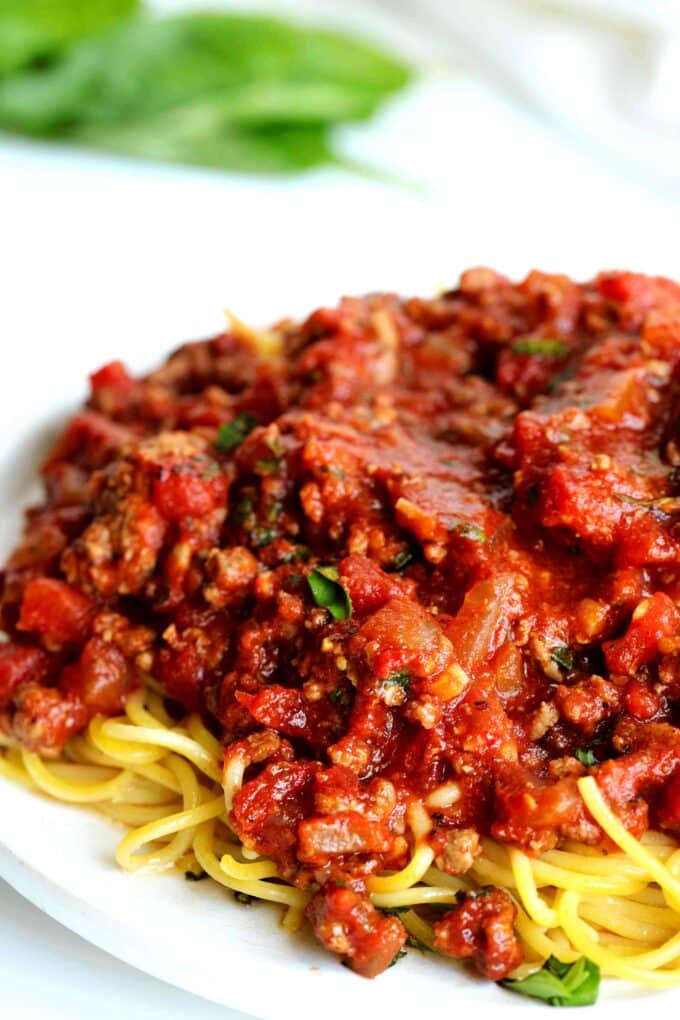 Meat sauce on top of spaghetti noodles