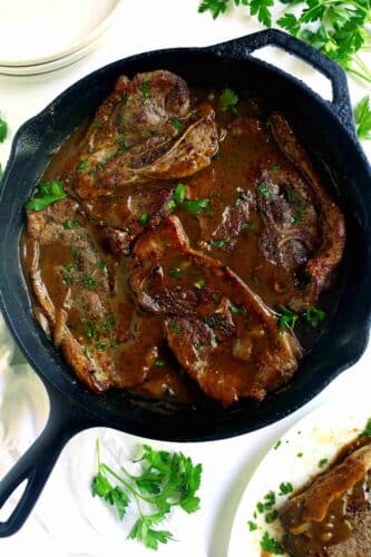 Overhead shot of Pork Steak in a cast-iron skillet