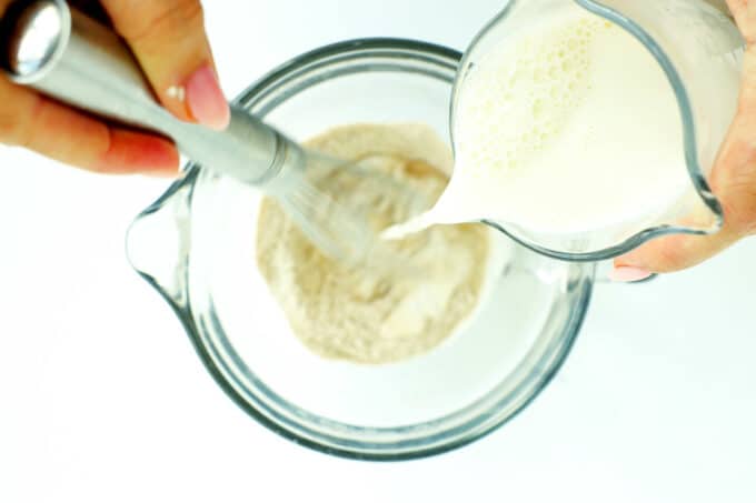 Adding half-and-half to dry ingredients for brioche French toast