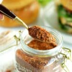 Hamburger seasoning in a jar with a spoonful