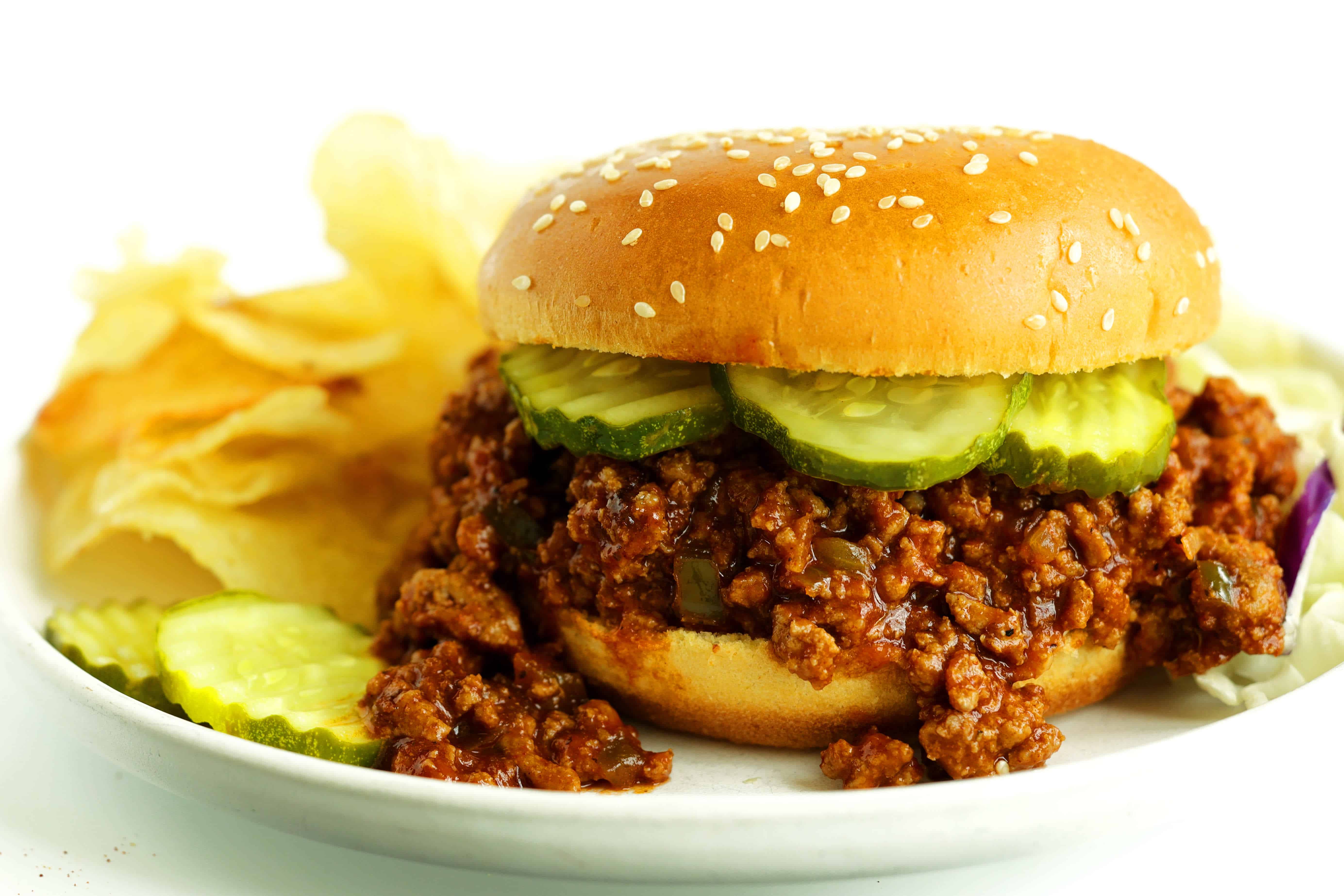Turkey Sloppy Joe with potato chips and sliced pickles