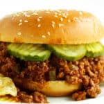 Turkey Sloppy Joe with potato chips and sliced pickles