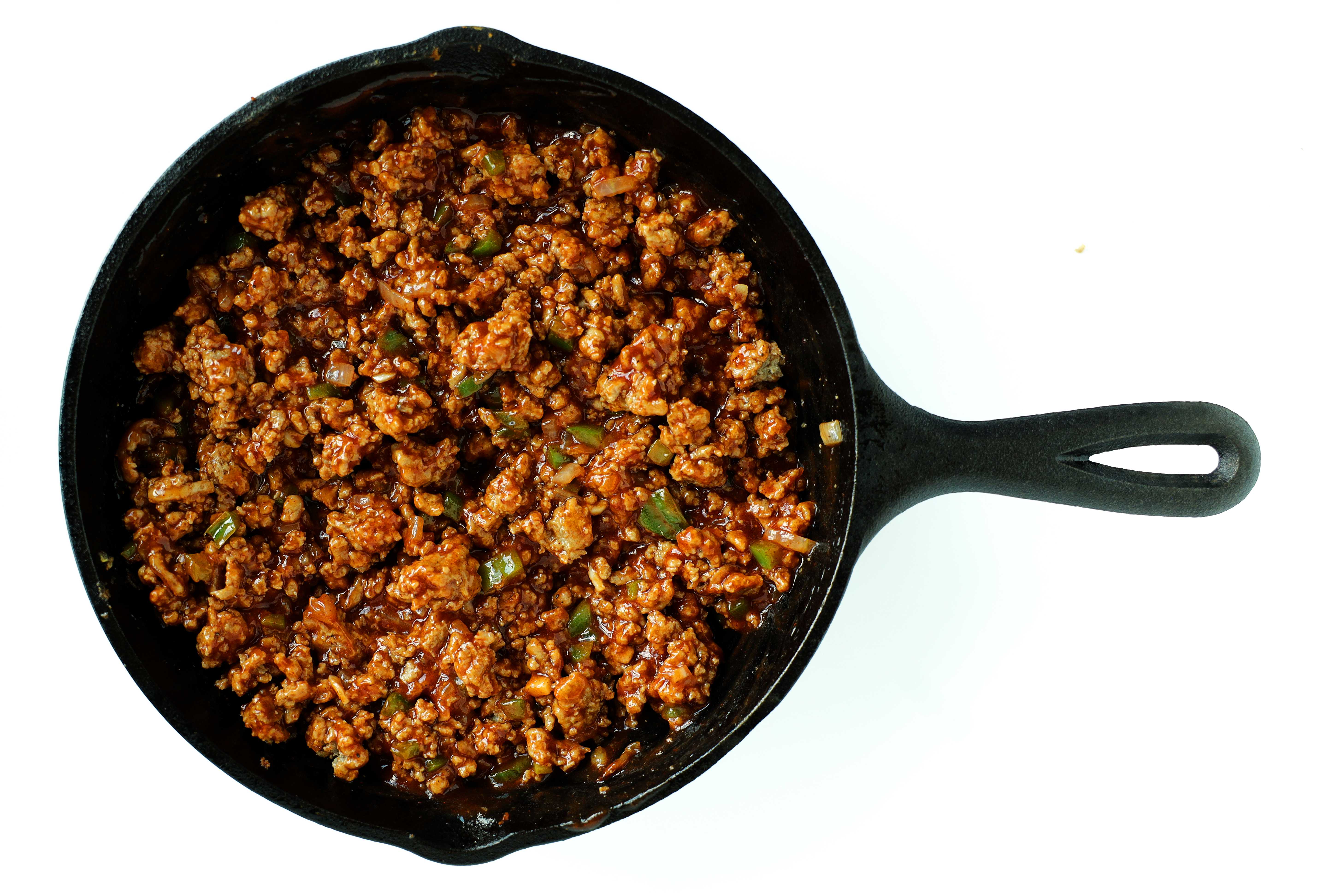 Turkey Sloppy Joe mixture in a cast iron skillet