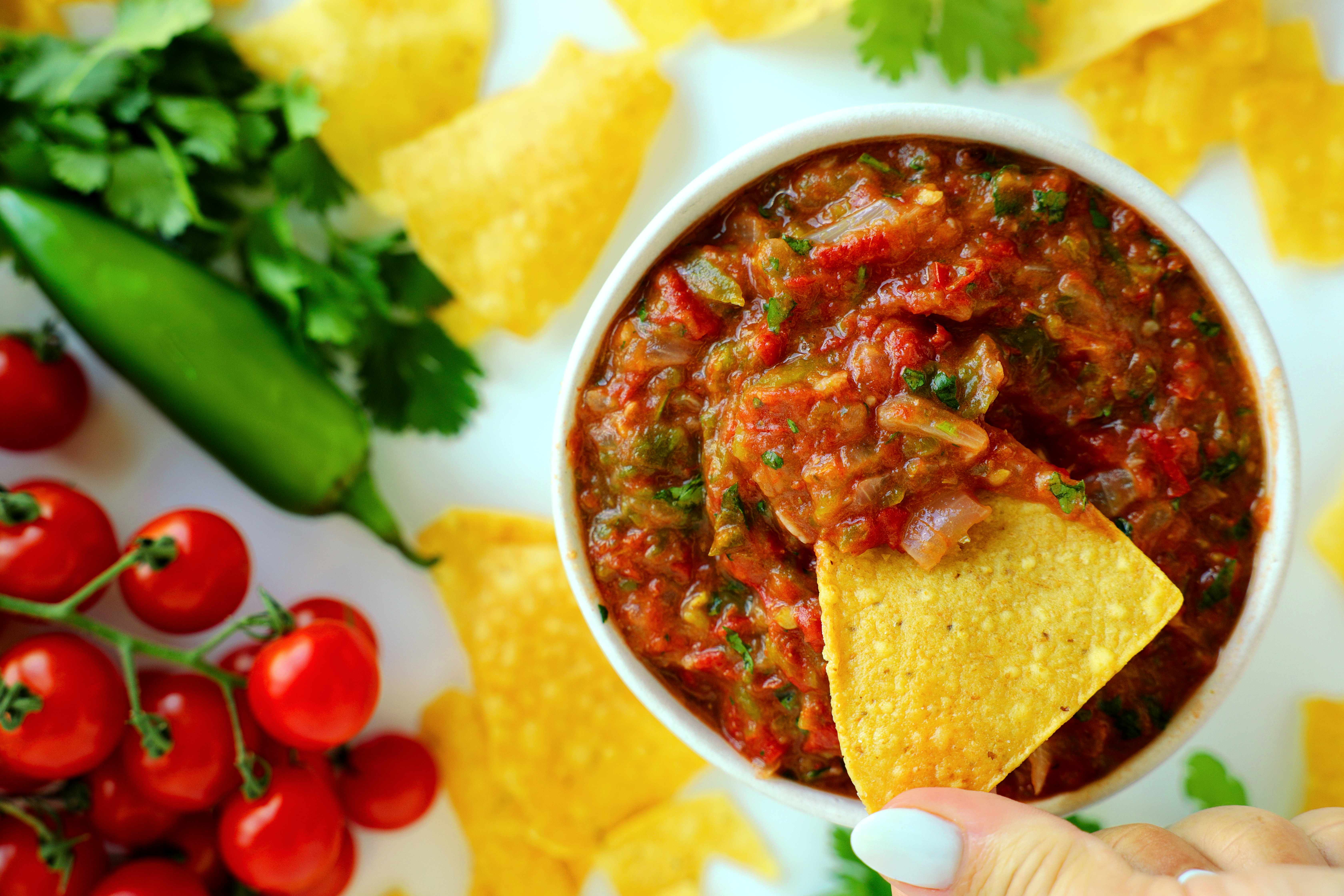 Overhead shot of Salsa Ranchera with a tortilla chip