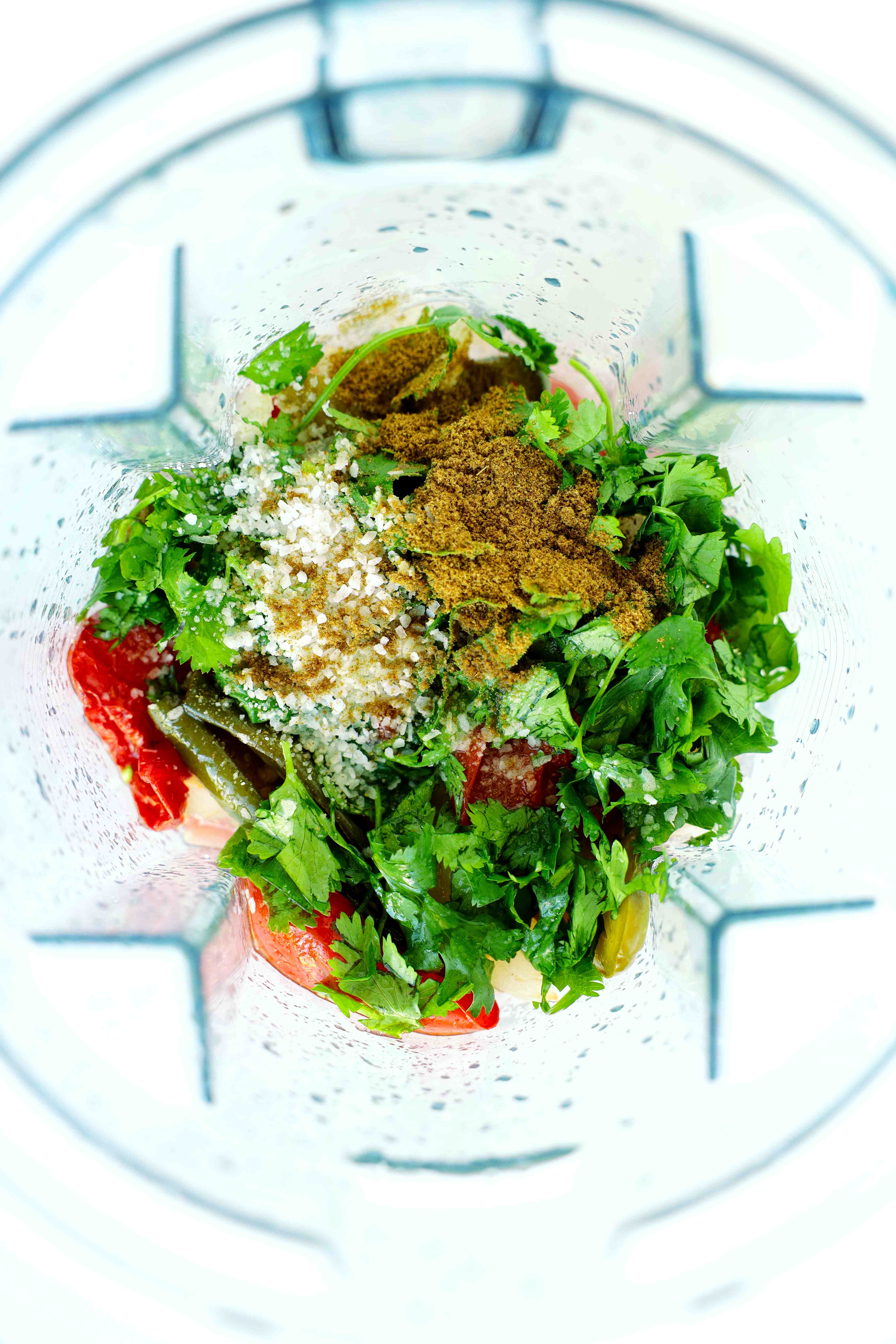All ingredients for salsa ranchera in a blender, not blended
