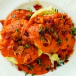 Overhead shot of biscuits topped with Tomato Gravy