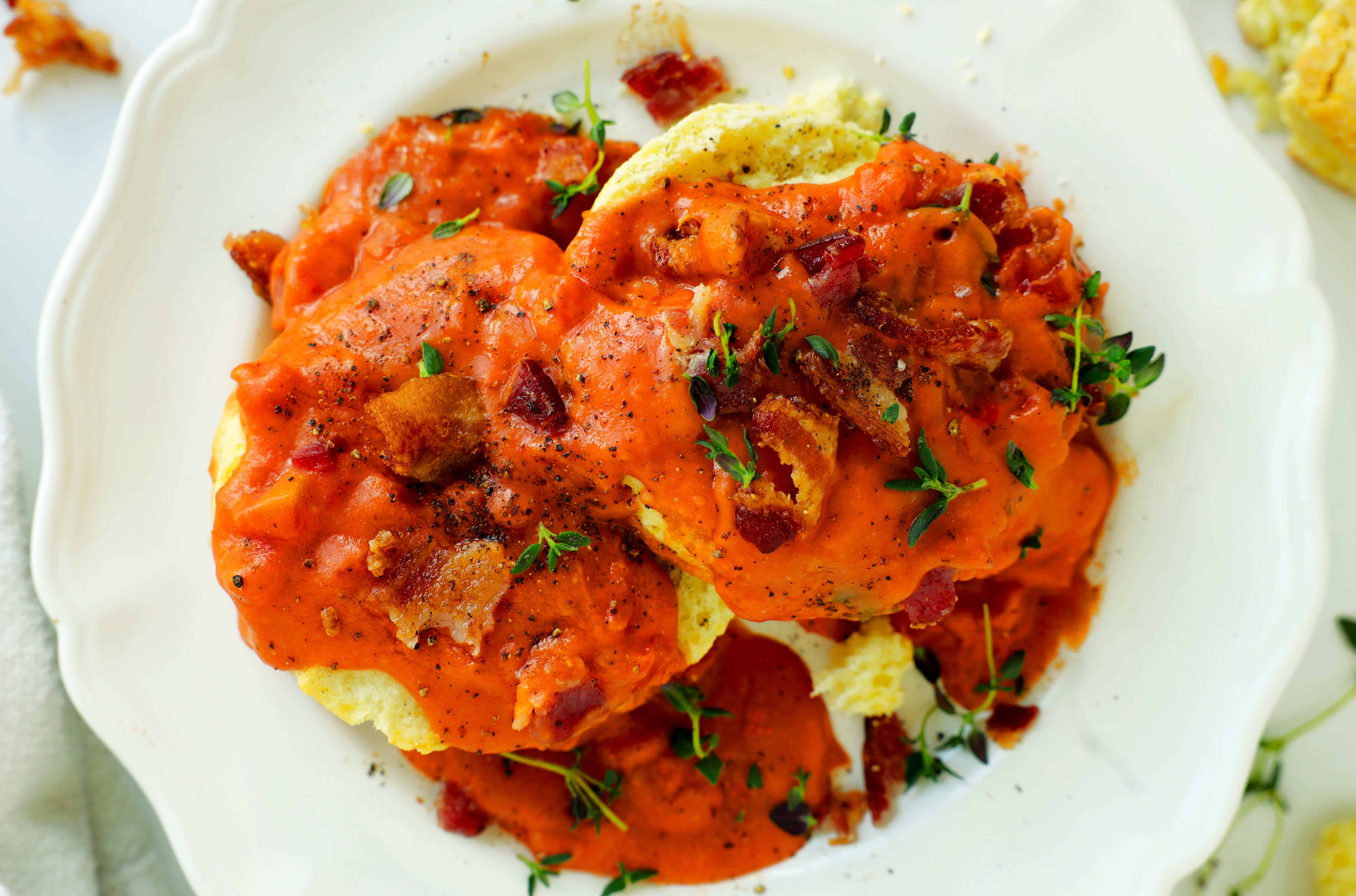 Overhead shot of biscuits topped with Tomato Gravy