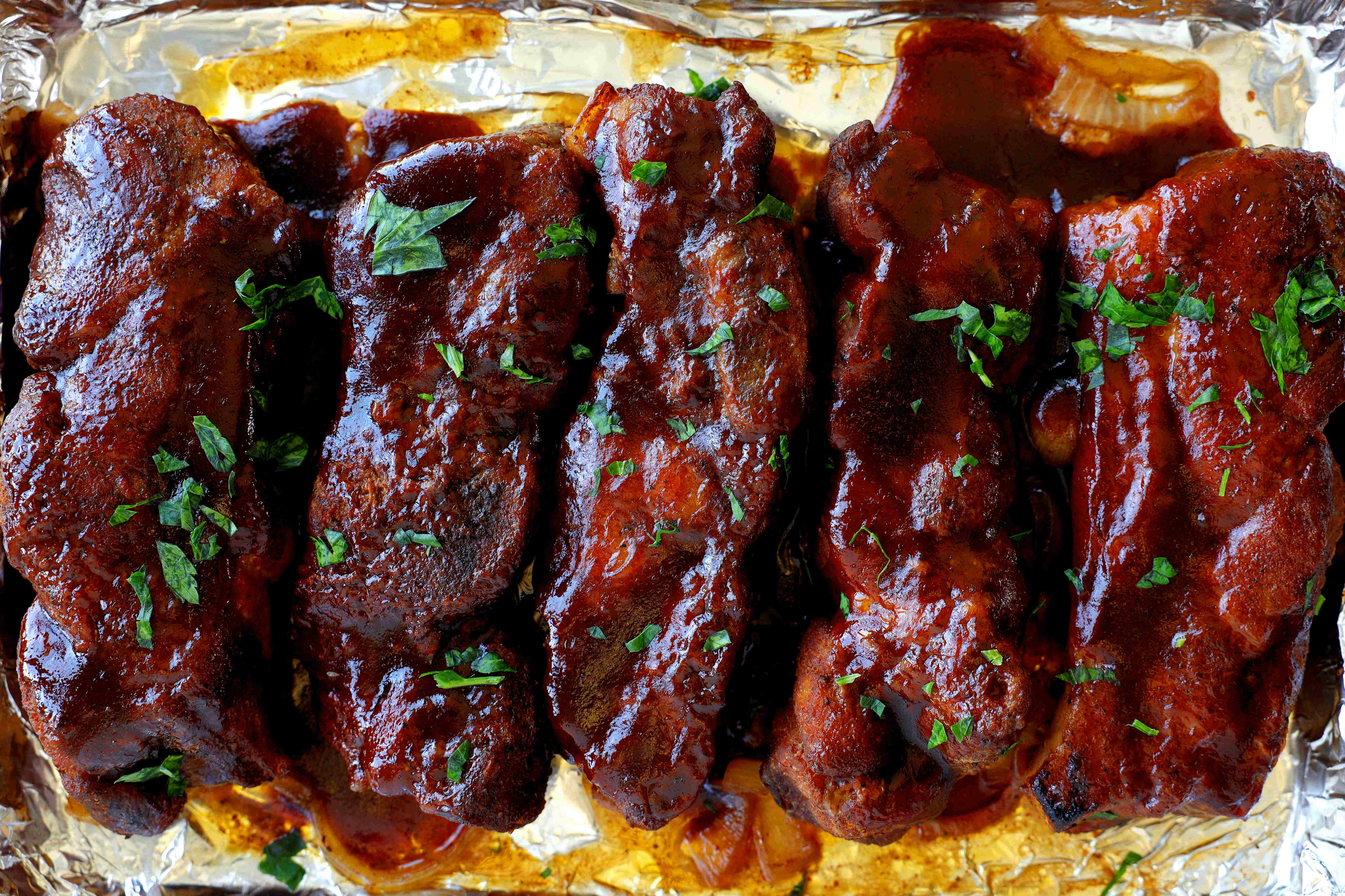 Closeup of Country-Style Pork Ribs on a baking sheet