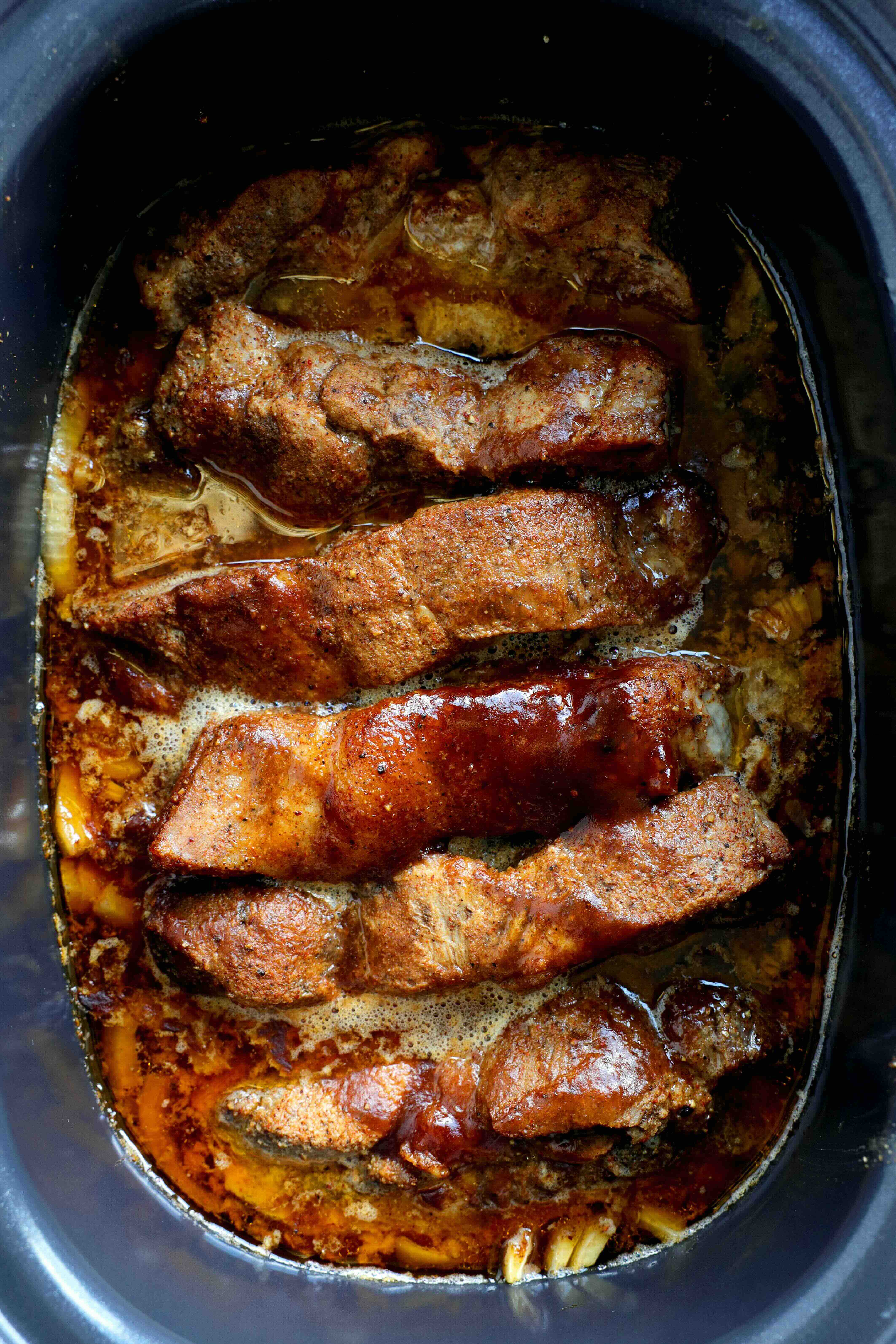 Closeup of Country-Style Pork Ribs in the slow cooker