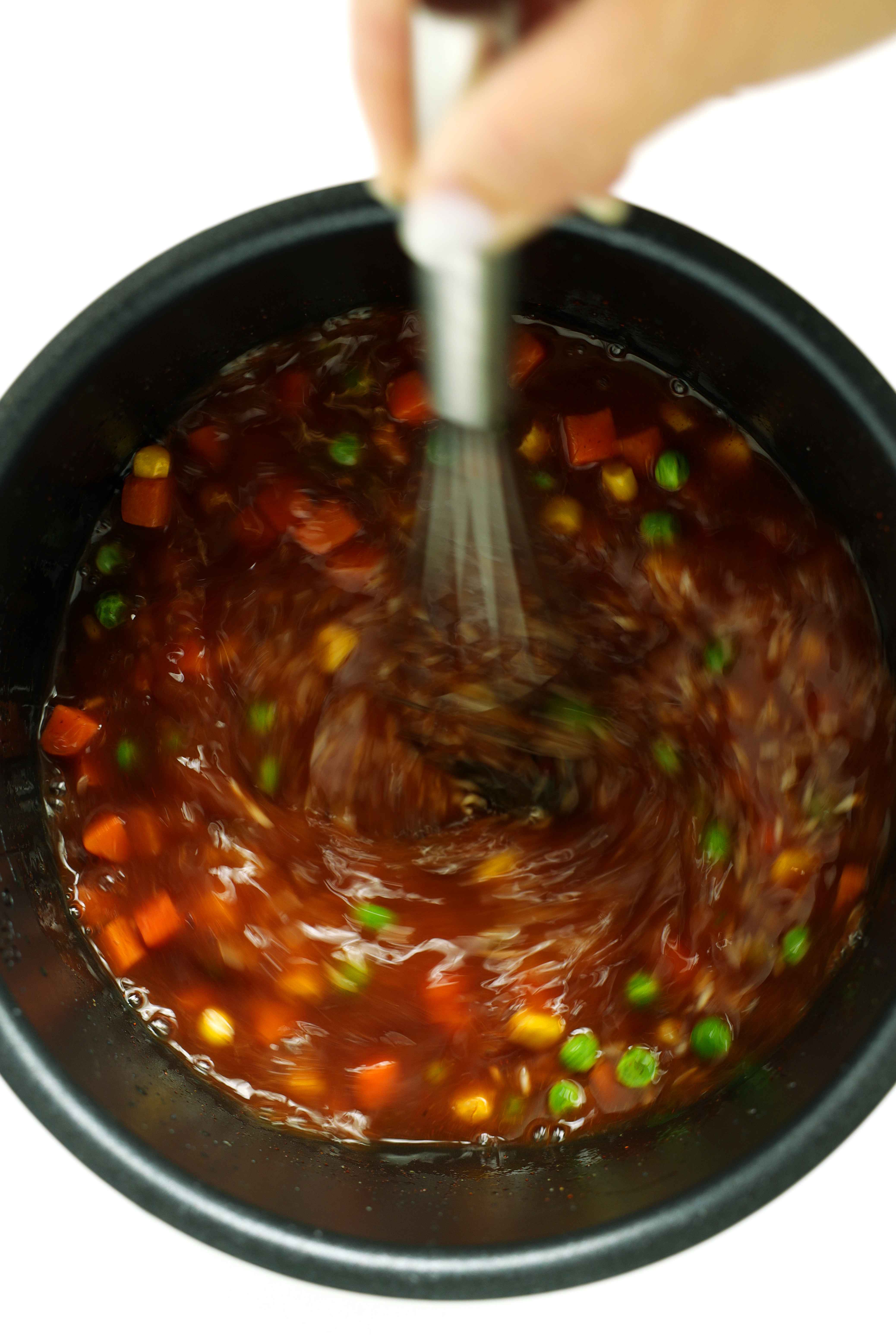 Whisking the Mexican Rice in the rice cooker