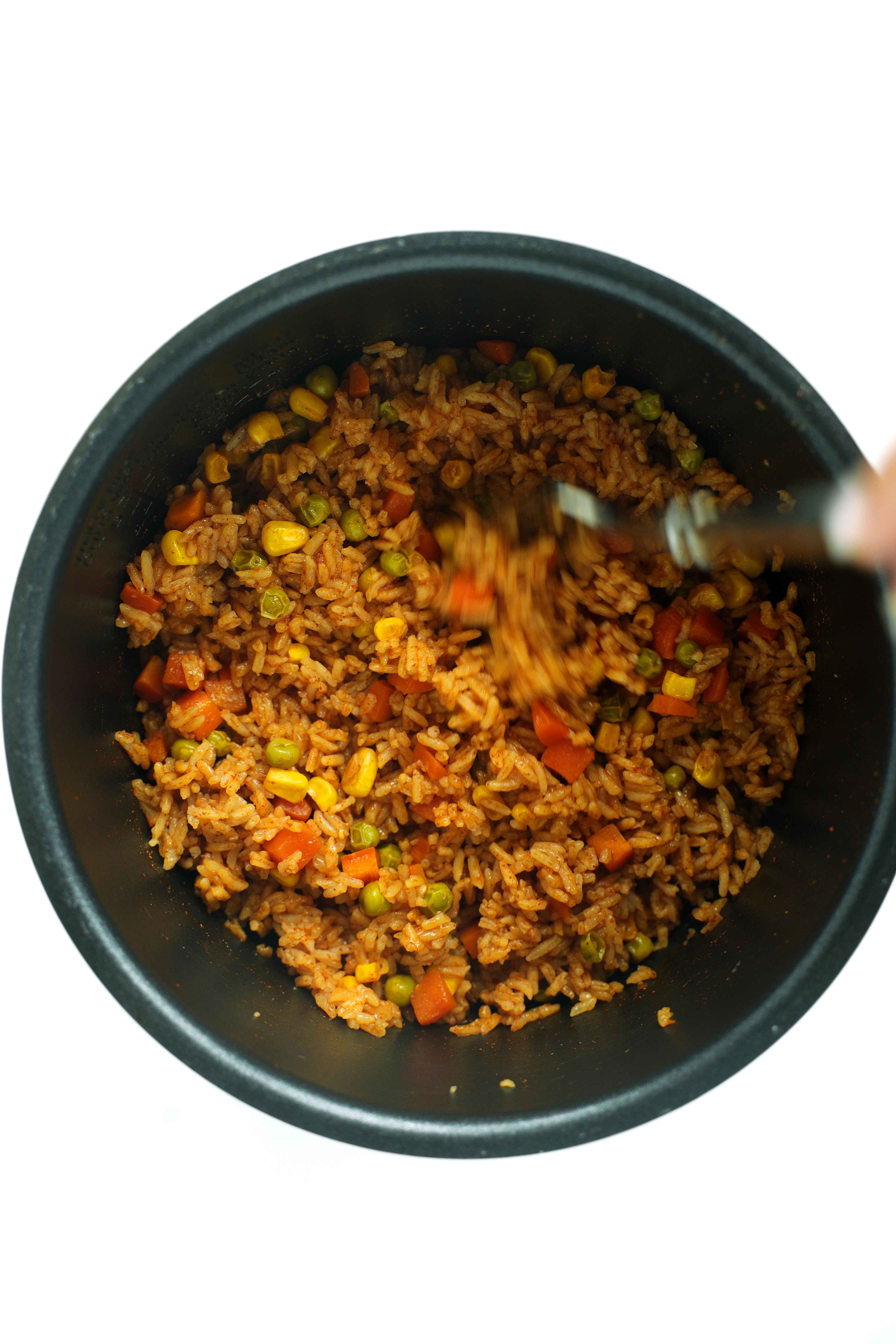 Stirring the Mexican Rice in the rice cooker