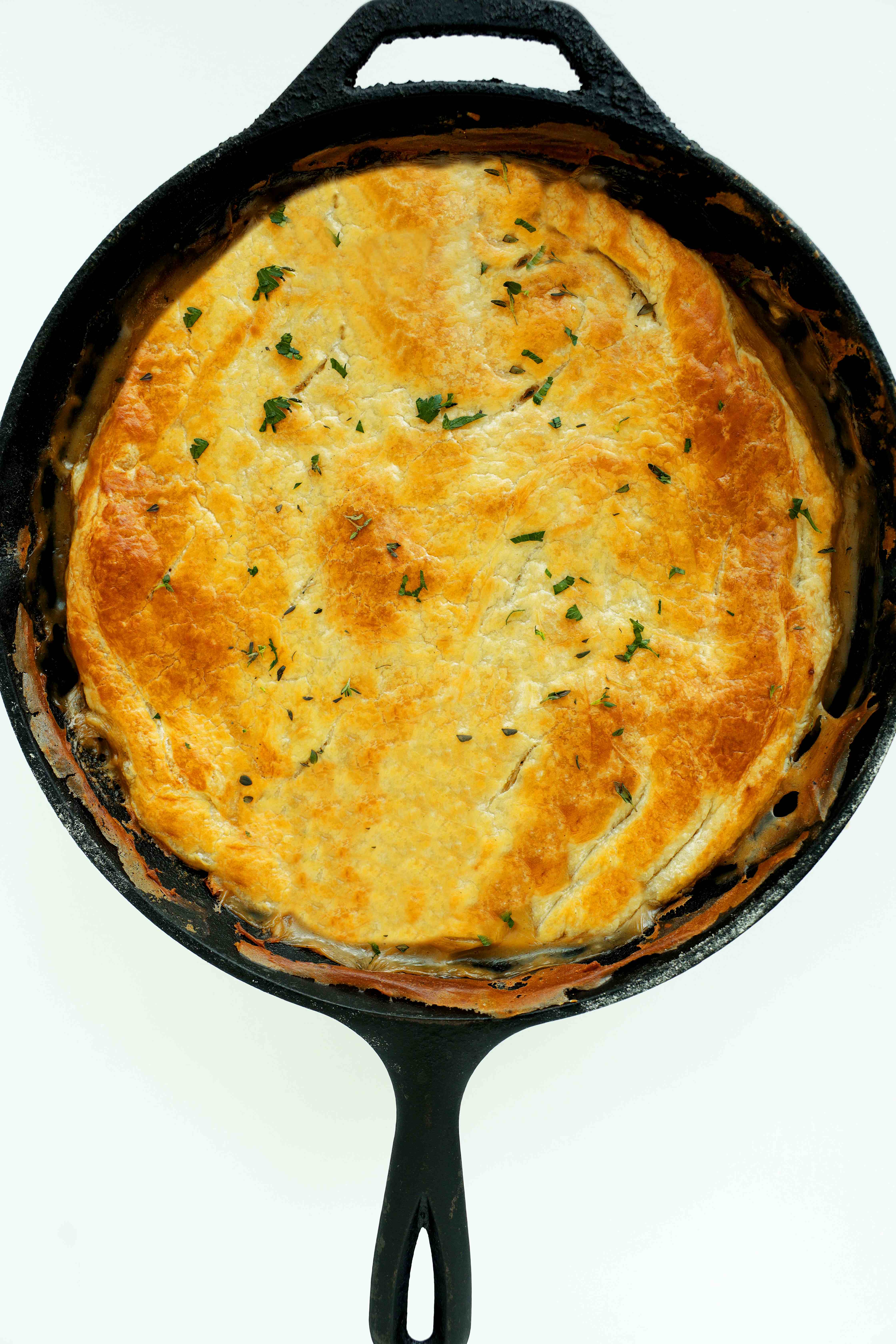 Overhead shot of Chicken Pot Pie with Puff Pastry in a cast iron skillet
