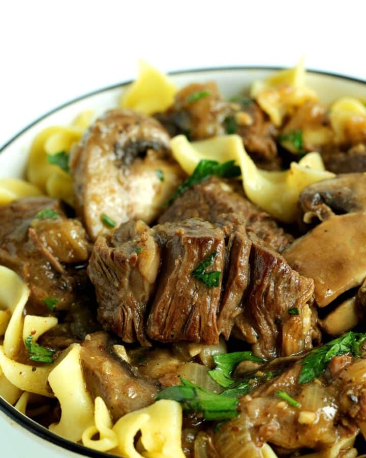 Closeup of crockpot beef tips and gravy