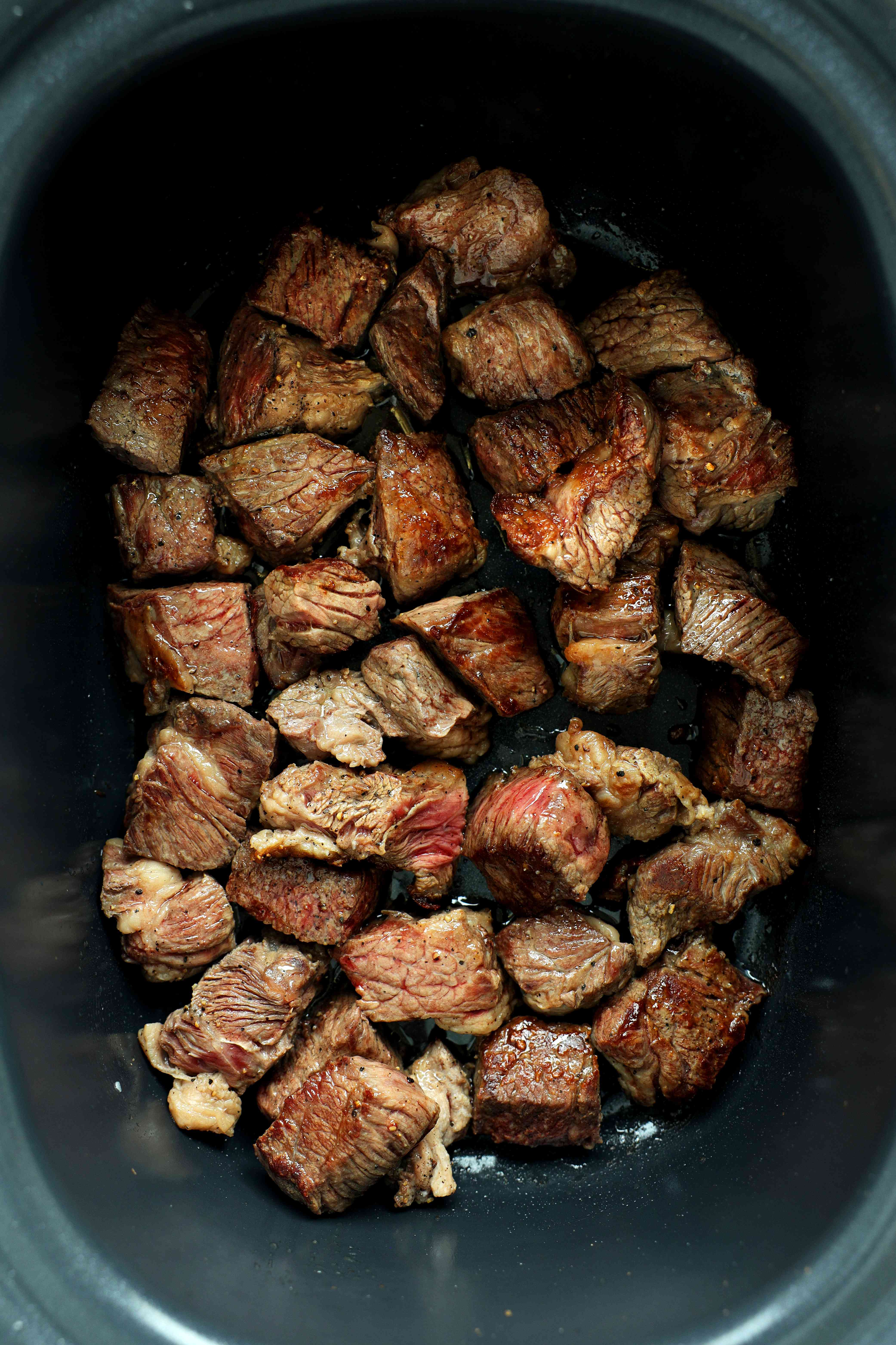 Browning the beef for crockpot beef tips and gravy