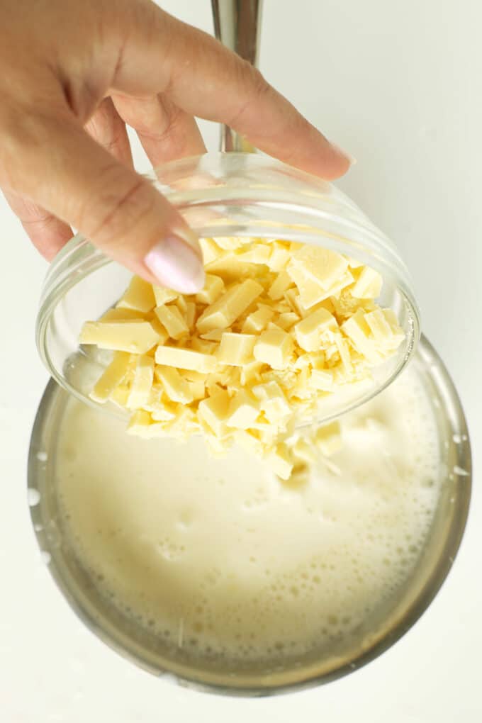 Adding butter to warmed ingredients for white hot chocolate
