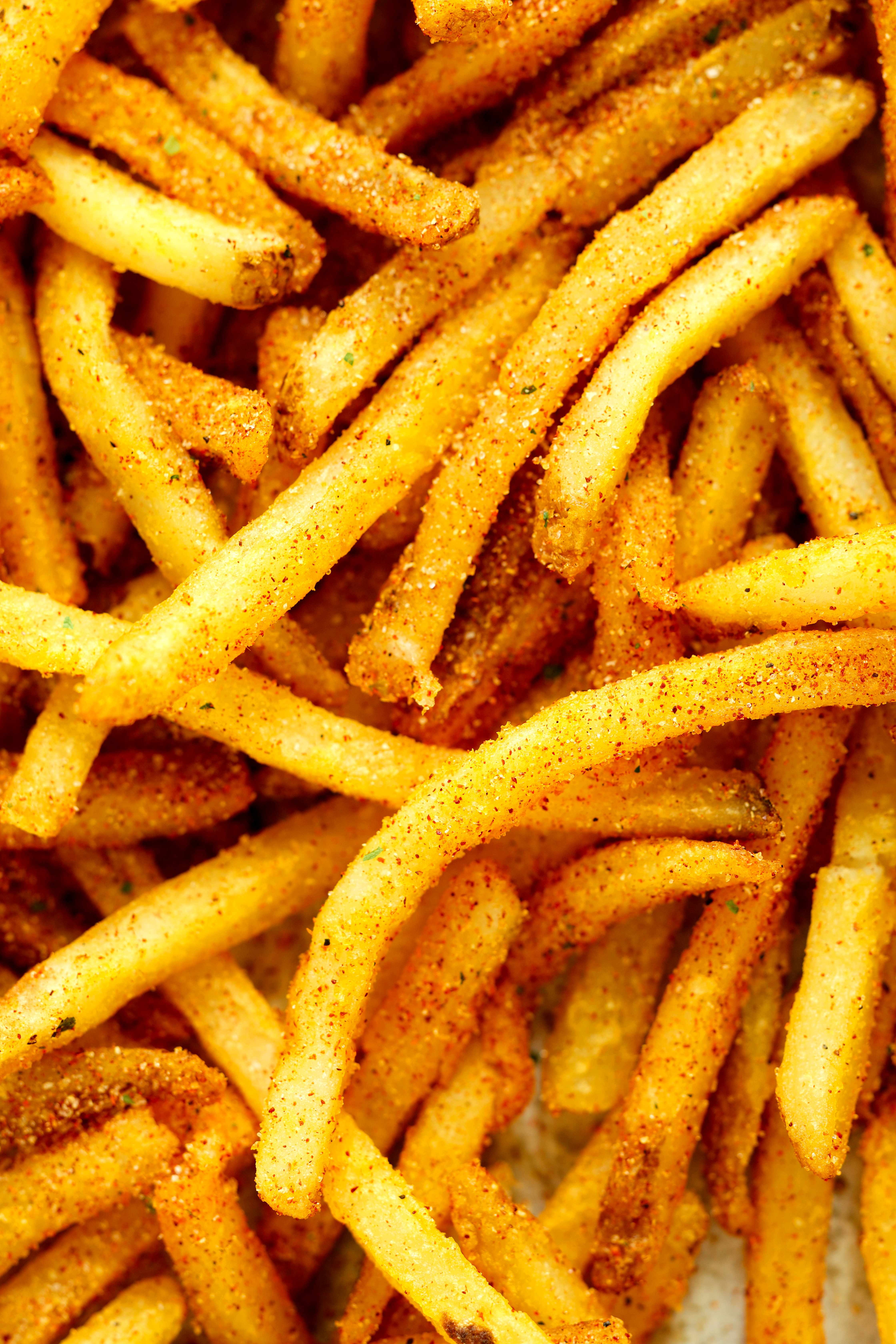 lose-up of crispy French fries coated with homemade fry seasoning blend.