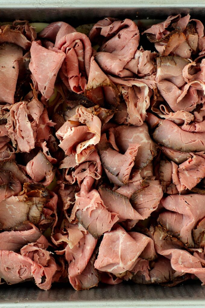 Thinly sliced deli roast beef piled onto provolone-covered Hawaiian rolls.