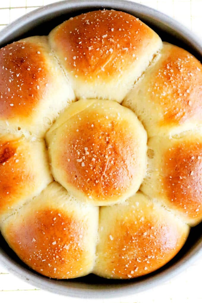 Golden, fluffy easy yeast rolls baked in a 9-inch pan—egg-washed tops with a sprinkle of Kosher salt, soft pull-apart centers.