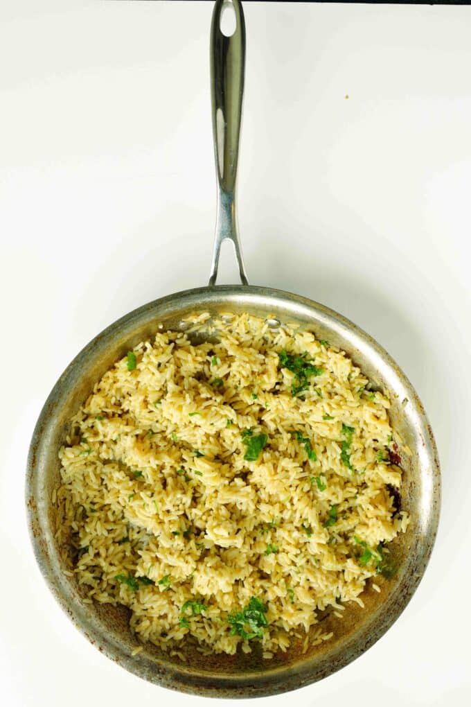 Cilantro lime rice in skillet for taco bowls recipe