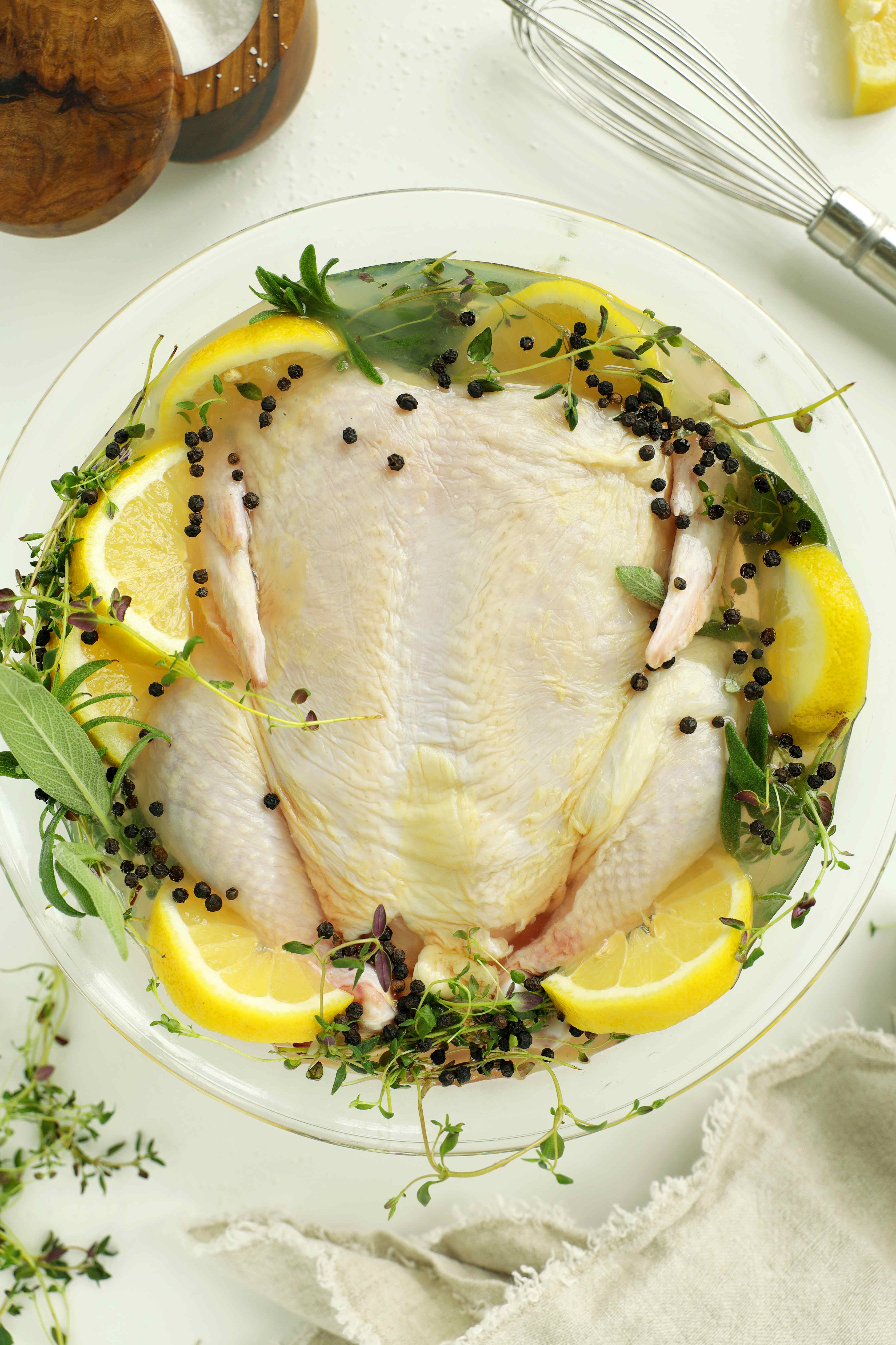 Carving a whole roasted chicken with knife and fork