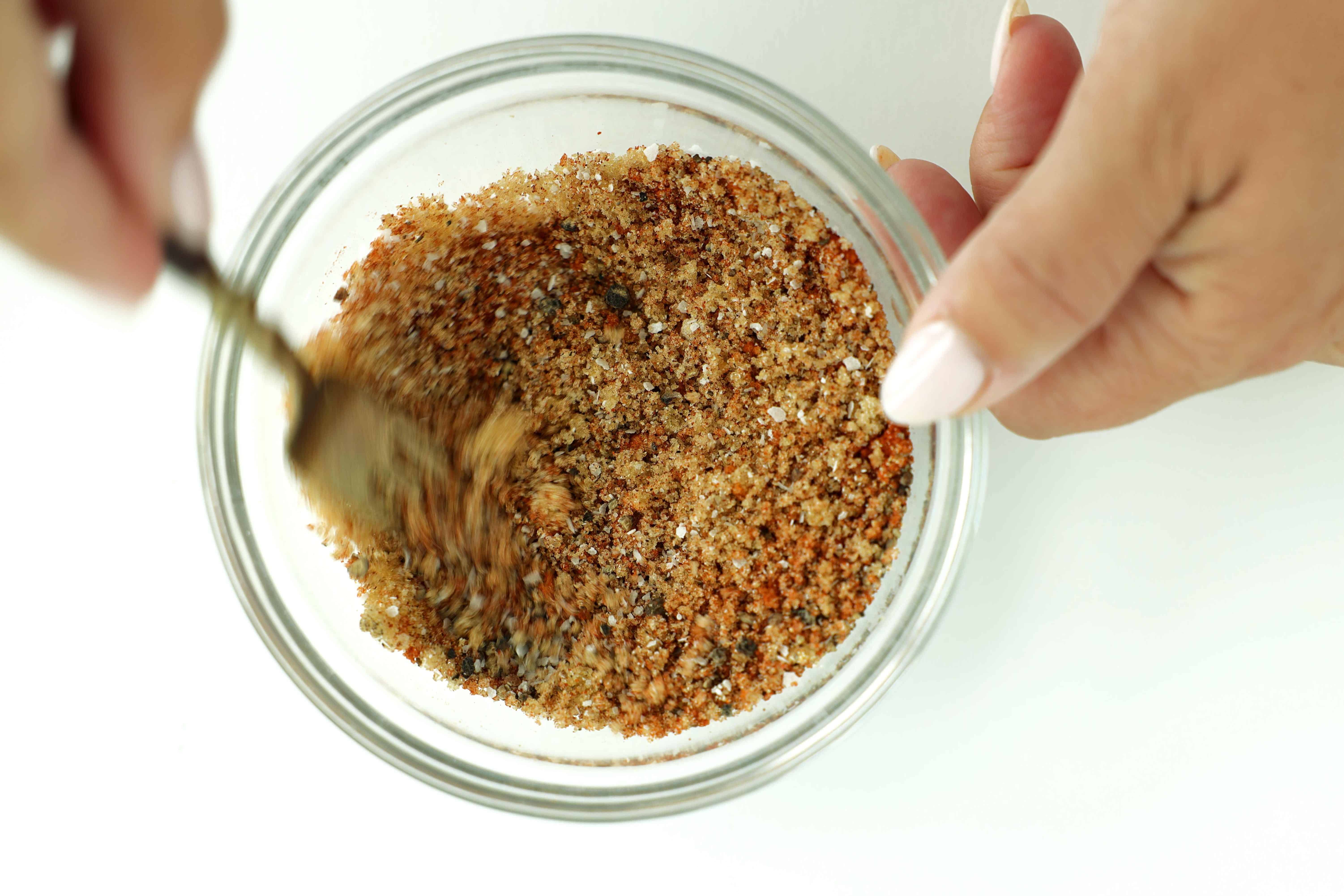 Homemade BBQ pork chop seasoning mixed together in a glass bowl.
